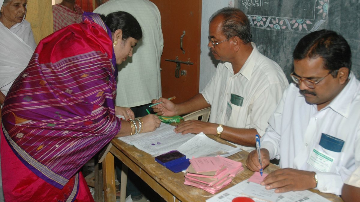 Voters registering their names at an Indian polling booth