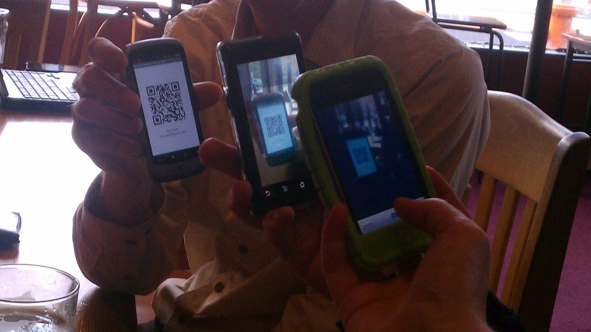 A mobile phone scanning a QR code