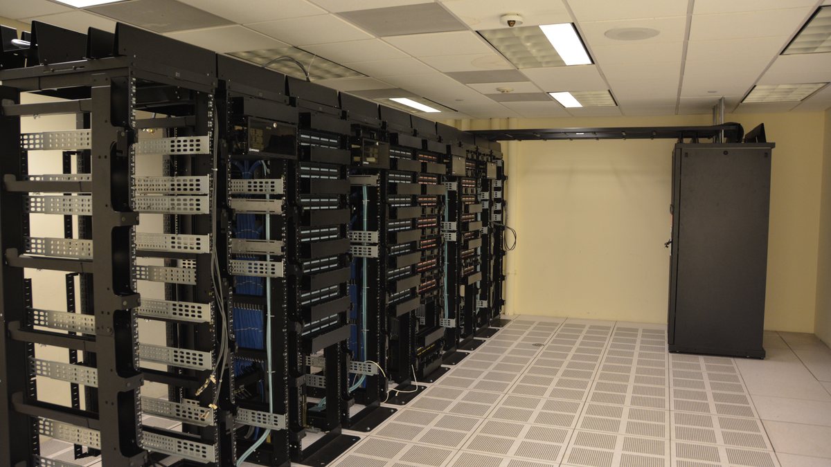 Rows of server racks inside a data centre